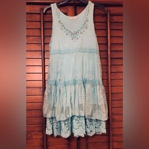 Worn once to a wedding. This soft boho aqua lace dress is unique!